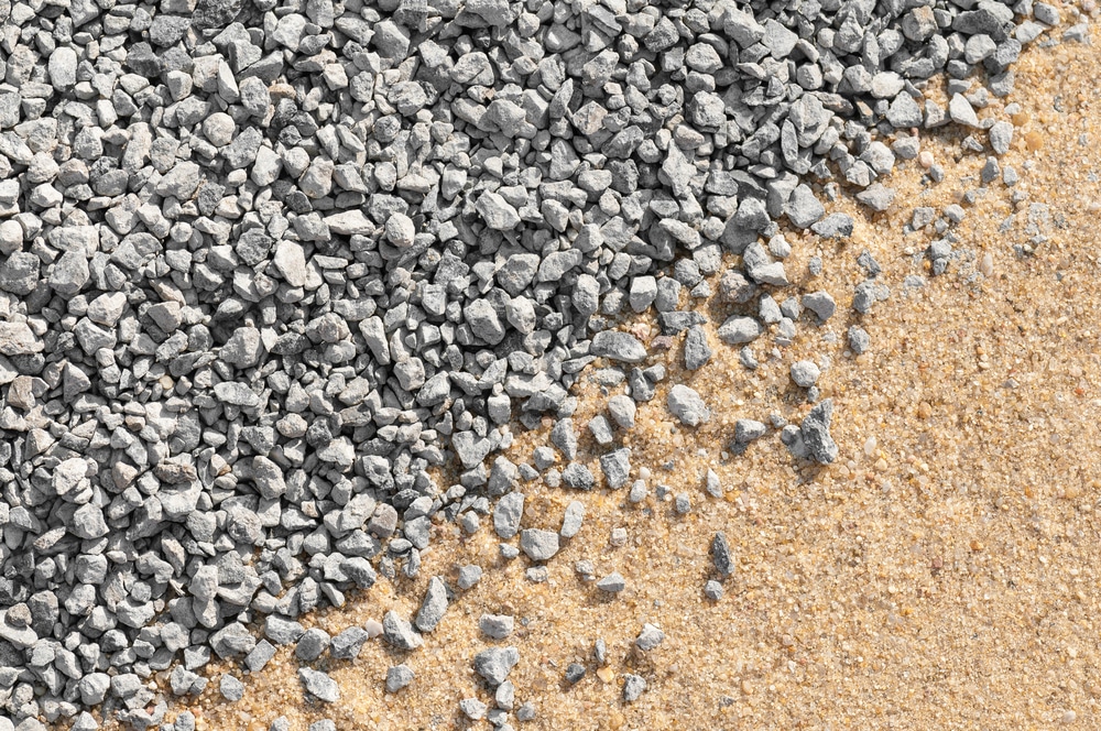 Fine grey gravel and building sand for background or texture - view from above; Construction materials; Fillings; Subsoil for paving